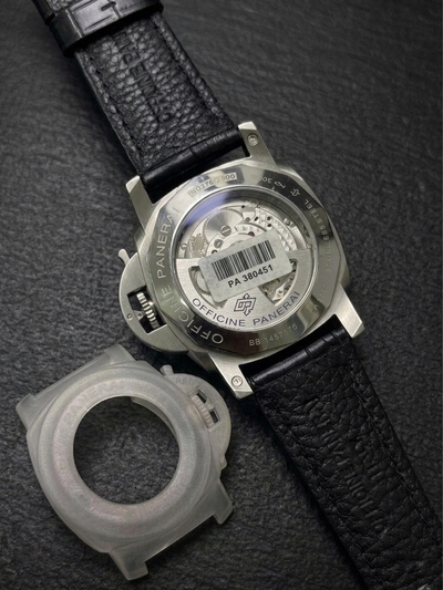 This watch is a Panerai Luminor Marina, likely model PAM01312 or a similar 44mm Luminor 1950 variant, featuring a black dial and a black leather strap._img_1