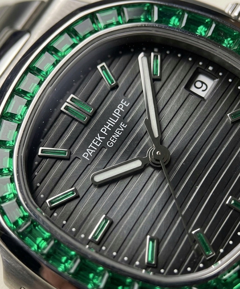 Patek Philippe Nautilus Ref. 5711/113P-001Black dial. Emerald brilliance. Pure luxury.
